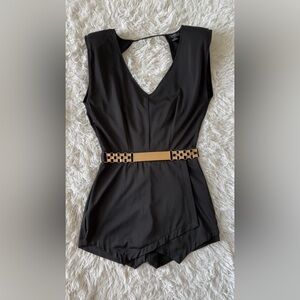 Chic Black and Gold Romper with Modern Silhouette